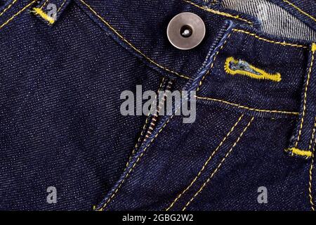 Nahaufnahme des Denim-Jeans-Knopfes Stockfoto