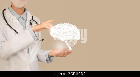 Ärztin hält virtuelles Gehirn in der Hand. Handgezeichnetes menschliches Organ, Kopierraum auf der rechten Seite, beige Farbe. Healthcare Krankenhaus Service Konzept Stock ph Stockfoto