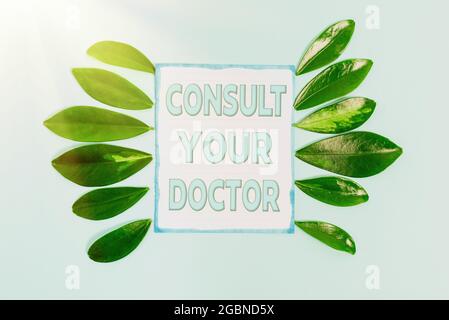 Textschild mit der Anzeige „Konsultieren Sie Ihren Arzt“. Business-Ansatz Fragen Sie Informationen oder Ratschläge von einem Arzt Professional Nature Theme Präsentation Ideen und Stockfoto