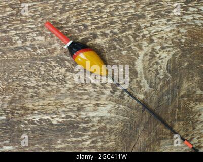old fishing bobbers with red antenna close-up Stockfoto