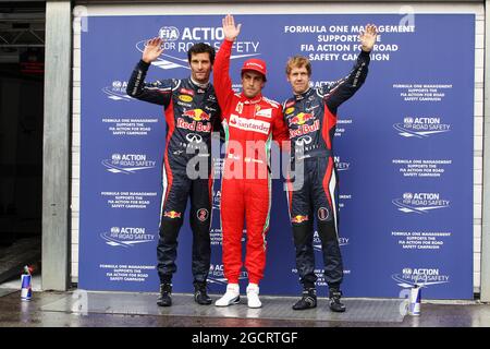 Qualifying Parc Ferme (L bis R): Mark Webber (AUS) Red Bull Racing, Dritter; Fernando Alonso (ESP) Ferrari, Pole Position; Sebastian Vettel (GER) Red Bull Racing, Dritter. Großer Preis von Deutschland, Samstag, 21. Juli 2012. Hockenheim, Deutschland. Stockfoto