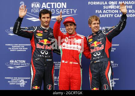 Qualifying Parc Ferme (L bis R): Mark Webber (AUS) Red Bull Racing, Dritter; Fernando Alonso (ESP) Ferrari, Pole Position; Sebastian Vettel (GER) Red Bull Racing, Dritter. Großer Preis von Deutschland, Samstag, 21. Juli 2012. Hockenheim, Deutschland. Stockfoto