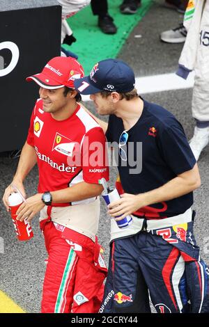 (L bis R): Felipe Massa (BH) Ferrari und Sebastian Vettel (GER) Red Bull Racing auf der Fahrerparade. Großer Preis von Brasilien, Sonntag, 25. November 2012. Sao Paulo, Brasilien. Stockfoto