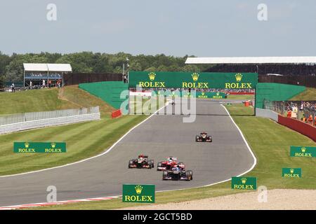 Jean-Eric Vergne (FRA) Scuderia Toro Rosso STR8 führt Fernando Alonso (ESP) Ferrari F138 und Romain Grosjean (FRA) Lotus F1 E21 an. Großer Preis von Großbritannien, Sonntag, 30. Juni 2013. Silverstone, England. Stockfoto