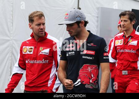 (L bis R): Sebastian Vettel (GER) Ferrari mit Carlos Sainz Jr (ESP) Scuderia Toro Rosso. Großer Preis von Kanada, Freitag, 5. Juni 2015. Montreal, Kanada. Stockfoto