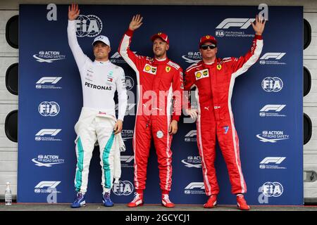 Qualifying Top 3 in Parc Ferme (L bis R): Valtteri Bottas (FIN) Mercedes AMG F1, Zweiter; Sebastian Vettel (GER) Ferrari, Pole Position; Kimi Räikkönen (FIN) Ferrari, Dritter. Großer Preis von Deutschland, Samstag, 21. Juli 2018. Hockenheim, Deutschland. Stockfoto