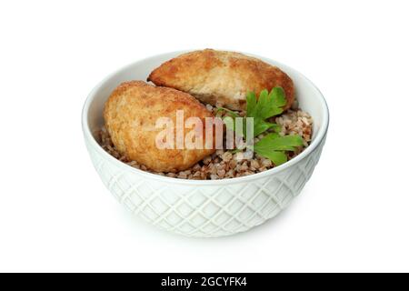 Schüssel mit Schnitzel, Buchweizen und Petersilie isoliert auf weißem Hintergrund Stockfoto