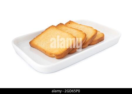 Biscottesi knusprige Biscottes. Horizontale knusprige Biscottes, quadratischer Cracker auf weißem Teller, auf weißem Hintergrund Stockfoto