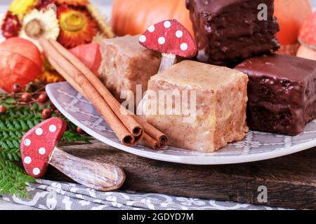 Gingerbread cubes in chocolate, sweet dessert, homemade cake. Stock Photo