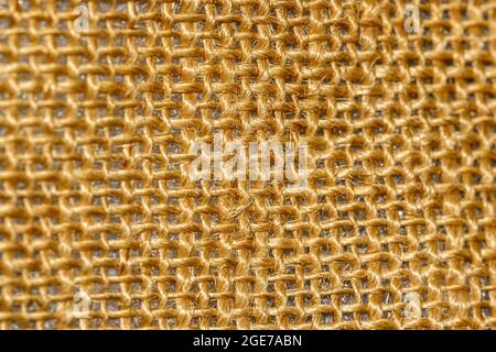 Gelber Weidenhintergrund für Design. Grobes Seilweben. Burlap-Hintergrund Stockfoto