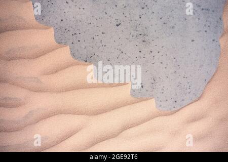 Sand Texturen Hintergrund auf dem Strand auf einer grauen Basis Stockfoto