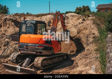 Baggerbagger graben auf einer Baustelle Stockfoto