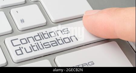 Eine Tastatur mit einer beschrifteten Taste - Nutzungsbedingungen auf französisch - Nutzungsbedingungen Stockfoto