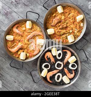 Paellas Gerichte Komposition hallo Ansicht, über Ansicht, kreative zeitgenössische Konzept mediterranen Set Stockfoto