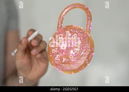 Person, die einen Stylus-Stift in der Nähe eines nummerierten 3D-Schlosses hält Stockfoto