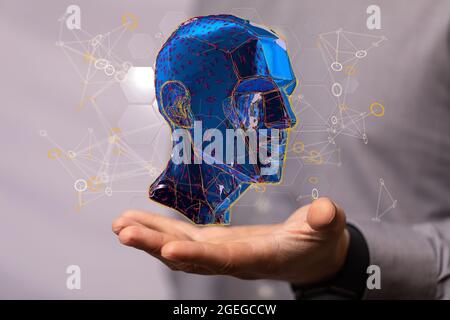 Männliche Hand mit einer 3D-Darstellung einer Cyborg-Kopfkonstruktion Stockfoto