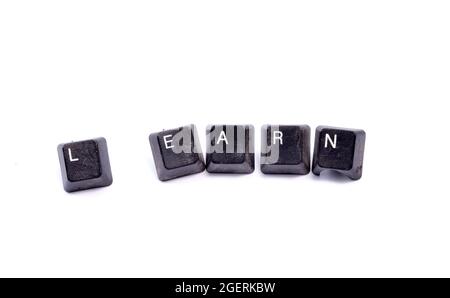 Wort schreiben Text Lernen. Geschäftskonzept. Verschmutzte, gebrauchte Brettentasten auf weißem Hintergrund Stockfoto