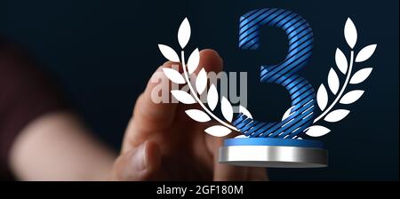 Eine 3D-Darstellung einer Trophäe auf dem 3. Platz mit einer echten Person im Hintergrund Stockfoto