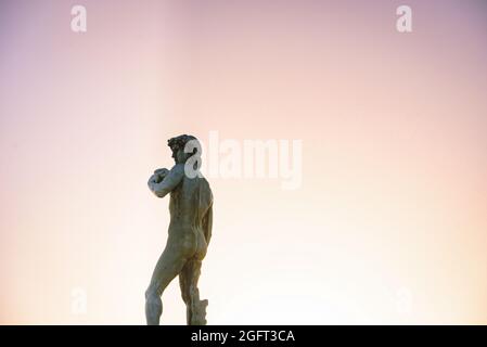 David-Statue vor einem Sonnenuntergang Himmel in Florenz, Toskana, Italien Stockfoto