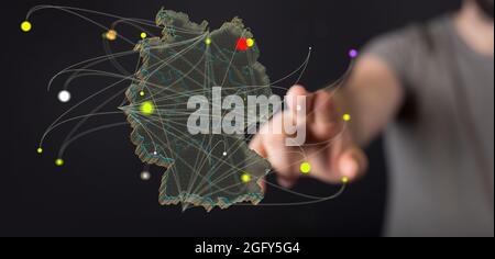 Nahaufnahme einer 3d-gerenderten deutschen Karte in der Hand eines Mannes Stockfoto
