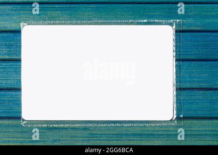 White empty blank business card, elegant frame, small piece of paper advertisement packed, sealed, wrapped in foil. Placeholder, place for text, borde Stockfoto