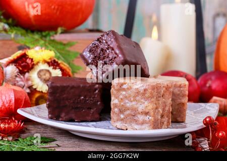 Gingerbread cubes in chocolate, sweet dessert, homemade cake. Stock Photo