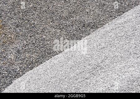 Grau und dunkelgrau zweifarbig. Kies verwendet, um Beton zu machen, mit Asphalt zu mischen, Schotterstraße oder Schotterweg zu schaffen, Schotterboden zu schaffen und gr Stockfoto