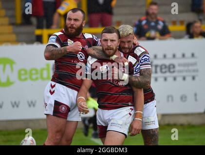 Castleford, West Yorkshire, Großbritannien. August 2021. Jackson Hastings von Wigan Warriors feiert seinen Versuch während des Betfred Super League-Spiels zwischen Castleford Tigers V Wigan Warriors am 22. August 2021 beim „Mend A Hose Jungle“, Castleford, West Yorkshire, Großbritannien Credit: Craig Cresswell/Alamy Live News Stockfoto