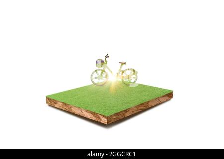 Grünes ökologisches Fahrrad auf Grasfeld isoliert auf weißem Hintergrund. Umweltfreundliches Konzept. Stockfoto