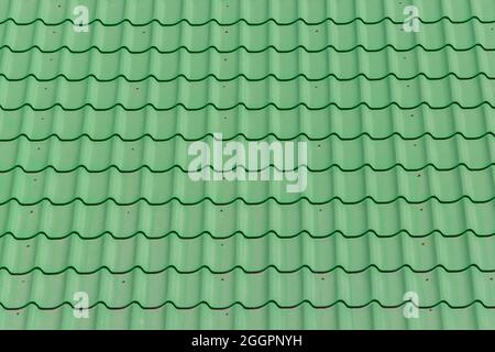 Grüne Fliesen und Dach Oberfläche Haus Muster Textur Hintergrund. Stockfoto