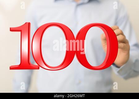 Digitale Vorlage zur Feier des 100-jährigen Bestehens, der Finger zeigte auf die schwebende 3d-Zahl 100 Stockfoto