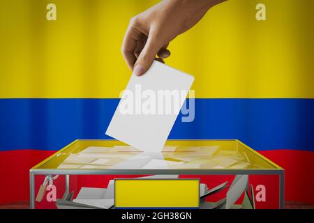 Kolumbien Flagge, Hand Drop Stimmzettel in eine Box - Abstimmung, Wahlkonzept - 3D-Illustration Stockfoto