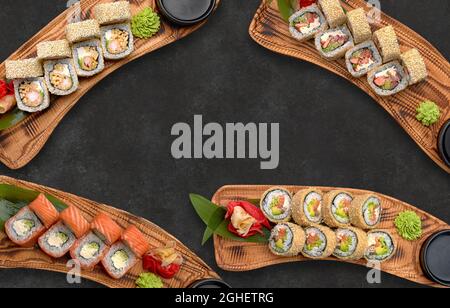 Verschiedene Sushi-Rollen auf dunklem Hintergrund Stockfoto