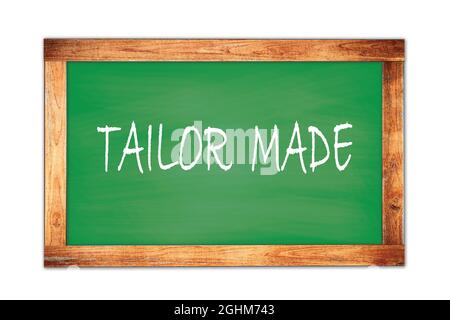 MASSGESCHNEIDERTE Text auf grünen Holzrahmen Schule Tafel geschrieben. Stockfoto