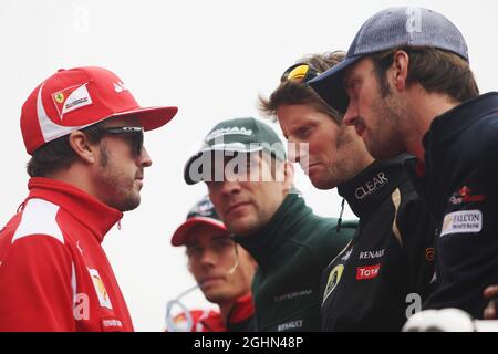 (L bis R): Fernando Alonso (ESP) Ferrari; Charles Pic (FRA) Marussia F1 Team; Vitaly Petrov (RUS) Caterham; Romain Grosjean (FRA) Lotus F1 Team und Jean-Eric Vergne (FRA) Scuderia Toro Rosso auf der Fahrerparade. 14.10.2012. Formel-1-Weltmeisterschaft, Rd 16, Großer Preis Von Korea, Yeongam, Südkorea, Wettkampftag. Stockfoto