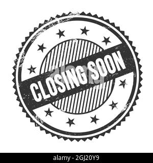 BALD SCHLIESSENDER Text auf schwarzem grungy Zickzack umrandet runden Stempel geschrieben. Stockfoto