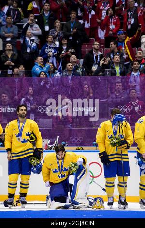 SOTSCHI 2014-02-23 die schwedischen Teamplayer Jimmie Oduya, Henrik Lundqvist und Gustav Nyqvist kämpfen nach dem Verlust des olympischen Eishockey-Finales Kanada gegen Schweden während der Olympischen Winterspiele 2014 in Sotschi in der Bolsjoj Arena in Sotschi, Russland, am 23. Februar 2014. Kanada gewann das Spiel mit 3:0. Foto: Pontus Lundahl / TT / kod 10050 Stockfoto