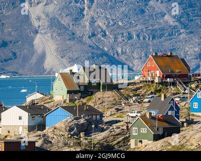 Die Stadt Uummannaq, nordwestlich von Grönland, liegt auf einer Insel im Uummannaq Fjordsystem. Stockfoto
