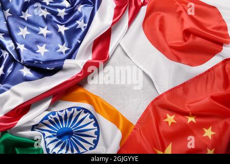 Flaggen von Japan, Indien, China und den USA auf hellem Hintergrund Stockfoto