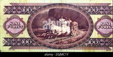 Auf der Rückseite der 100-1-Forint-Banknote 1984 von der Magyar-Bank steht eine Pferdekutsche aus einem Gemälde, die Zuflucht vom Sturm durch Lot genommen hat Stockfoto