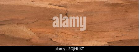Rötlich-braune Farbe Ton Holz Maserung Oberfläche, nahtlose Hintergrundstruktur für grafische Gestaltung Stockfoto