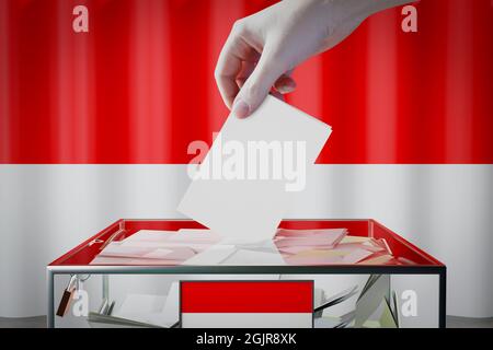 Hesse-Flagge, Hand Drop Stimmzettel in eine Box - Abstimmung / Wahl in Deutschland Konzept - 3D-Illustration Stockfoto