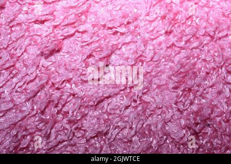 Helle, pinke Teppichstruktur. Stockfoto