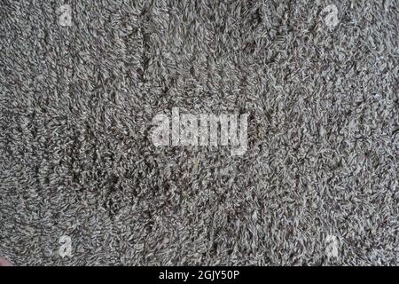 Nahaufnahme verwendete weiße - graue - braune Fußmatte für jeden alten Vintage-Design-Stil. Stockfoto