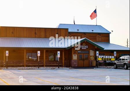 Humble, Texas USA 09-06-2019: Texas Roadhouse Restaurant in Humble, TX. Das 1993 gegründete Hotel ist bekannt für seine tollen Steaks und seine fröhliche Atmosphäre. Stockfoto