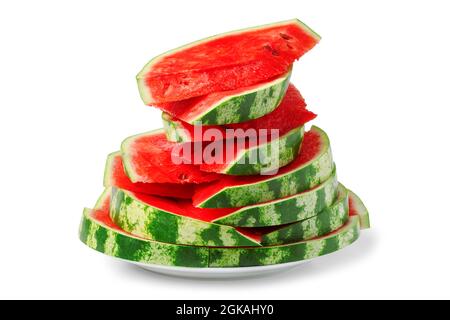Stücke von roten reifen Wassermelonen sind mit einem Dia auf einer Platte ausgekleidet Stockfoto