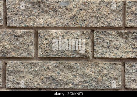 Graue Steinmauer. Ein Fragment einer Mauer aus Ziegel und Mörtel.Raum für den Text Stockfoto