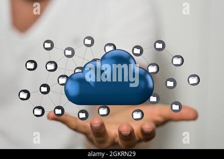 3d-Rendering von Computerordnersymbolen über einem großen blauen Cloud-Speichersymbol in einer Hand Stockfoto