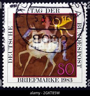 DEUTSCHLAND - UM 1983: Eine in Deutschland gedruckte Briefmarke zeigt Postrider, Stamp Day, um 1983 Stockfoto
