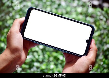 Gaming Gesture Smartphone, Blank Screen Smartphone in beiden Händen Stockfoto
